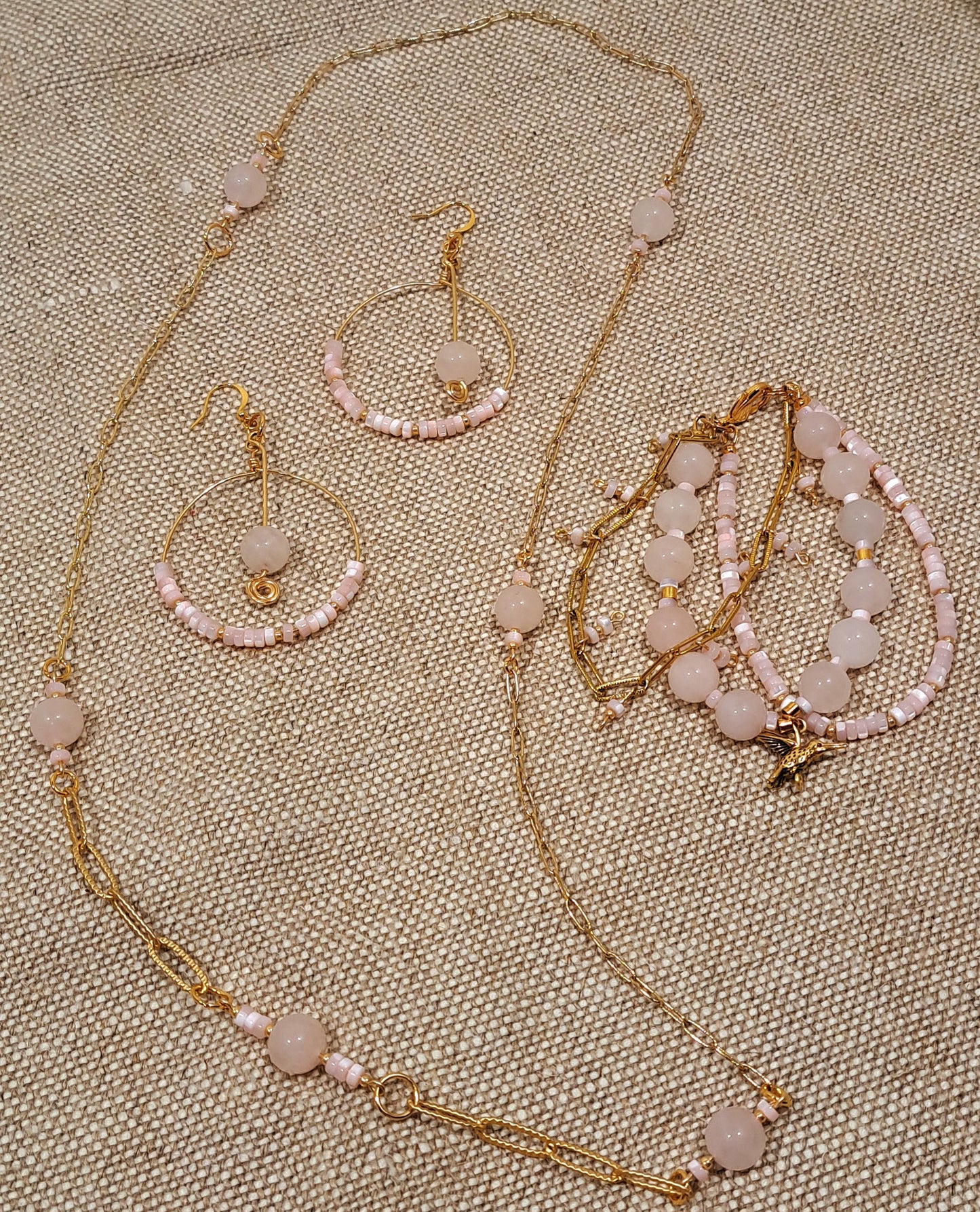 Ladies 3 strand Rose quartz gemstone, paperclip chain, and mother of pearl bracelet.