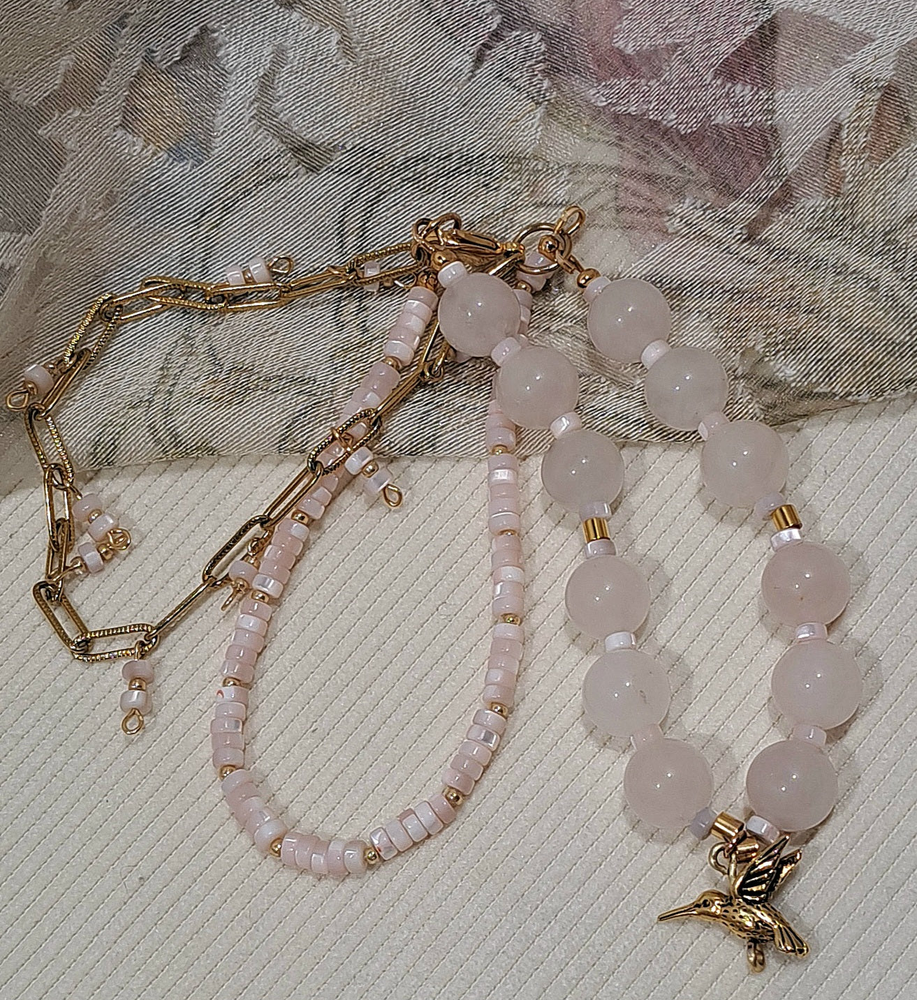 Ladies 3 strand Rose quartz gemstone, paperclip chain, and mother of pearl bracelet.