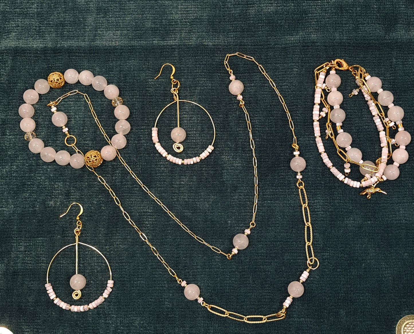 Ladies  necklace with Rose Quartz beads suspended amongst gold plated paperclip style chain.