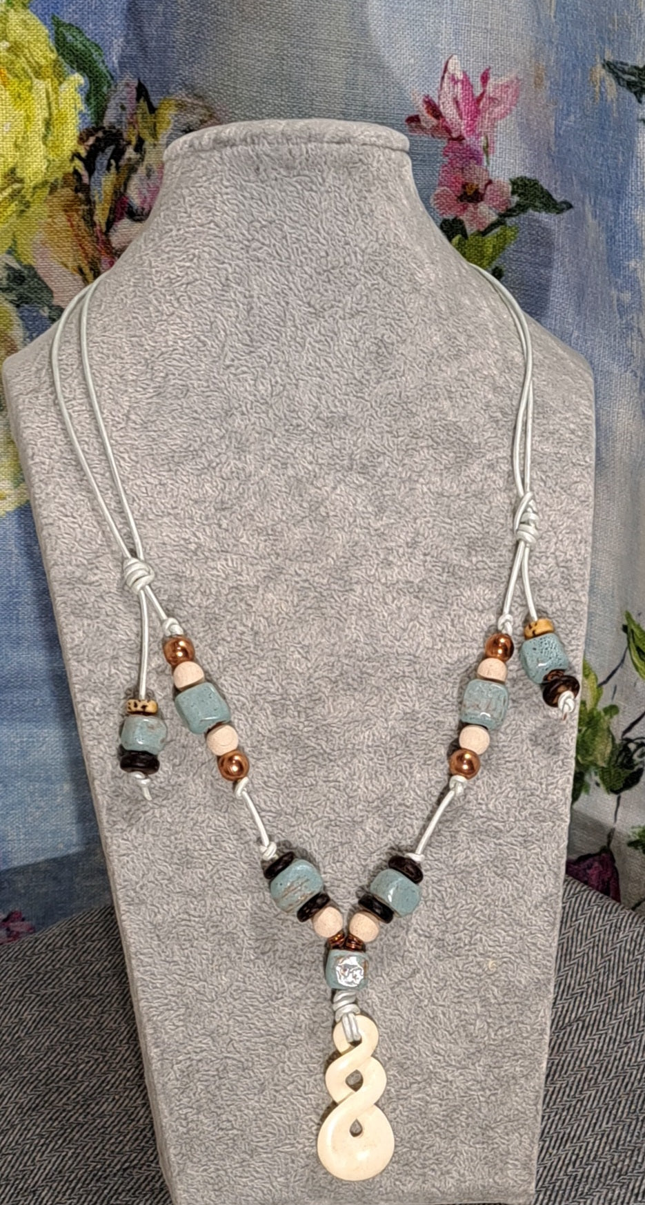 Ladies Maori Love twist design pendant  and blue terra cotta adjustable necklace.