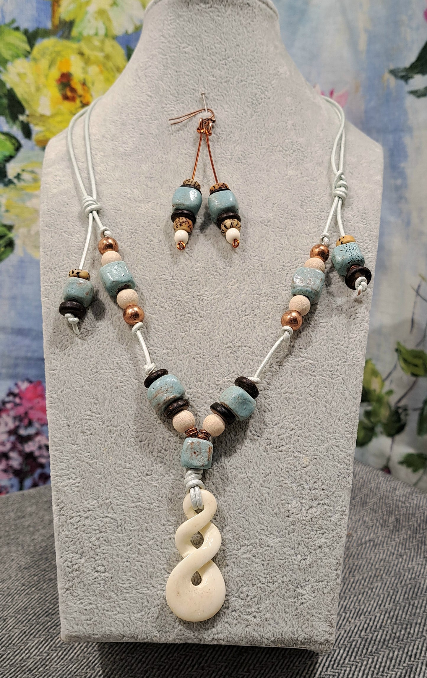 Ladies Maori Love twist design pendant  and blue terra cotta adjustable necklace.