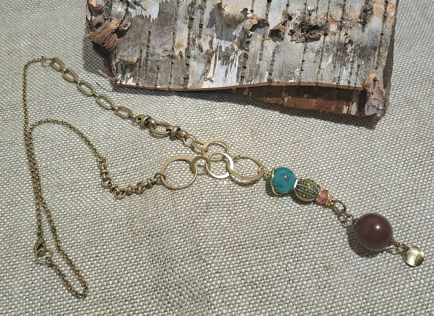 Brass varied link necklace with unusual bead combination.