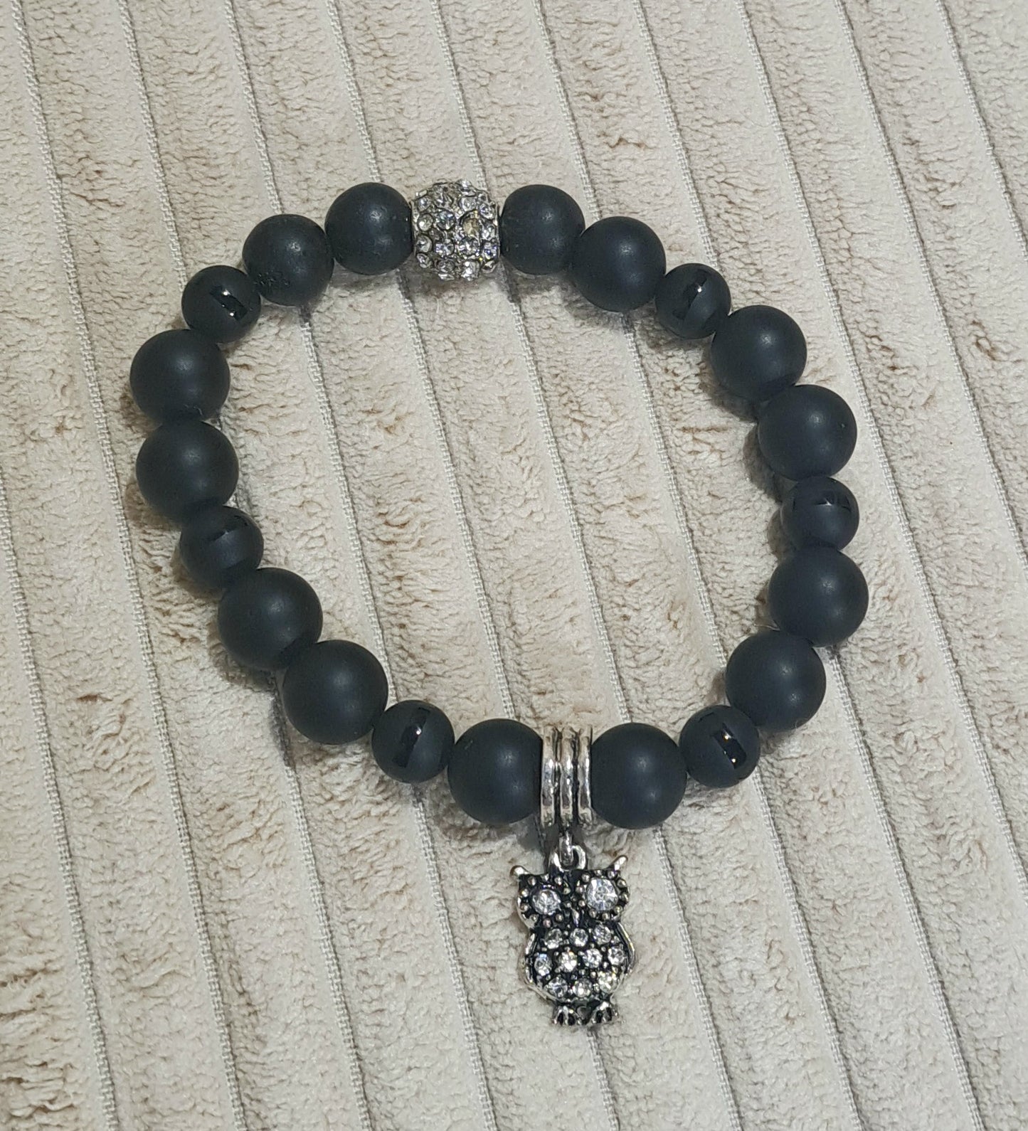 Unisex stretch Black Onyx and Striped Black Onyx bead bracelet with sparkle Owl and bead accents.