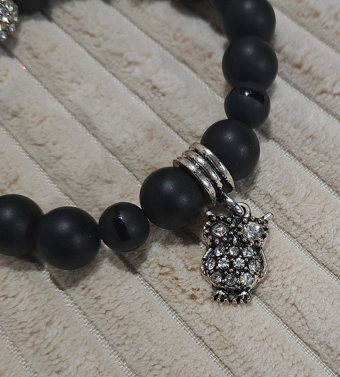 Unisex stretch Black Onyx and Striped Black Onyx bead bracelet with sparkle Owl and bead accents.