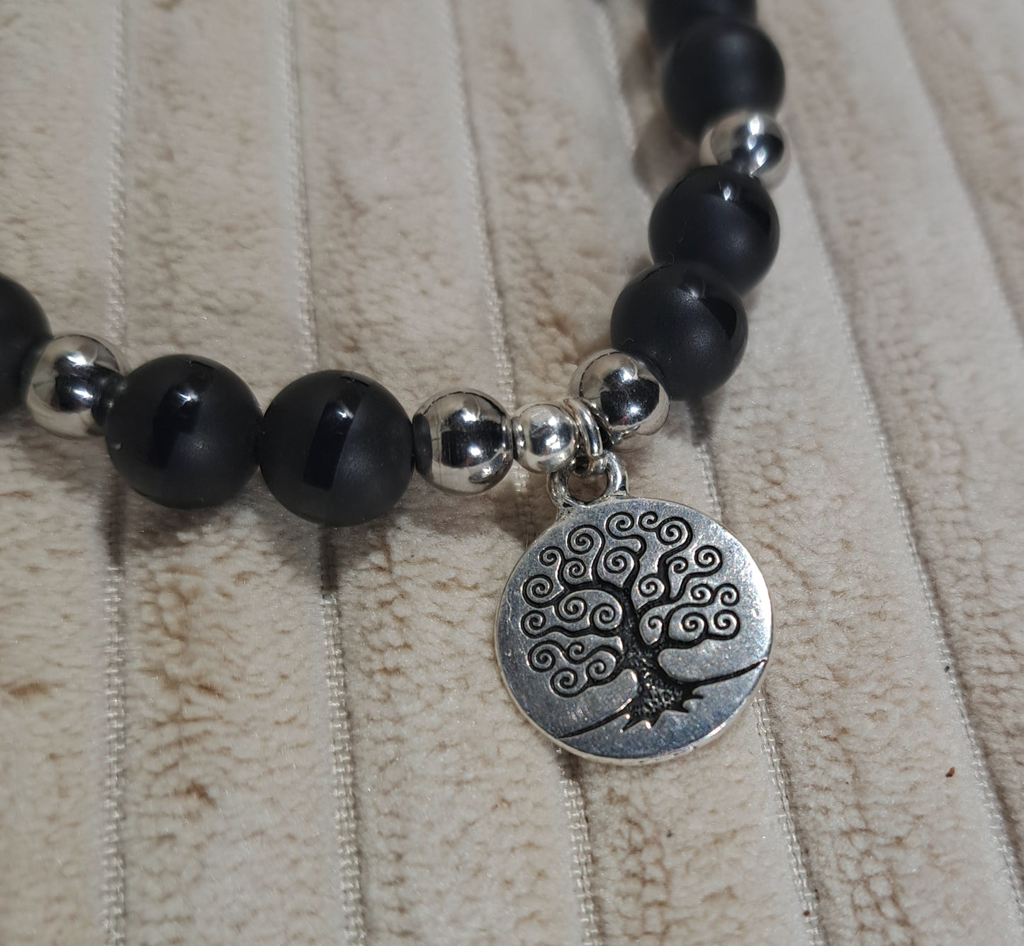 Unisex Tree of Life stretch bracelet of striped Black Onyx  and Steel spacers.