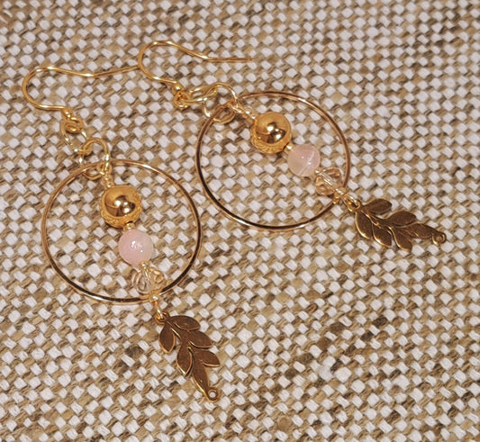 Ladies Gold hoops with Selenite and gold dangle beads and leaf motif.