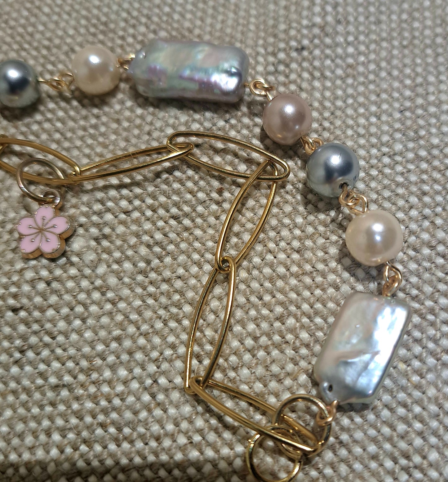 Ladies double strand paperclip chain and Biwa and mixed pearl bracelet.