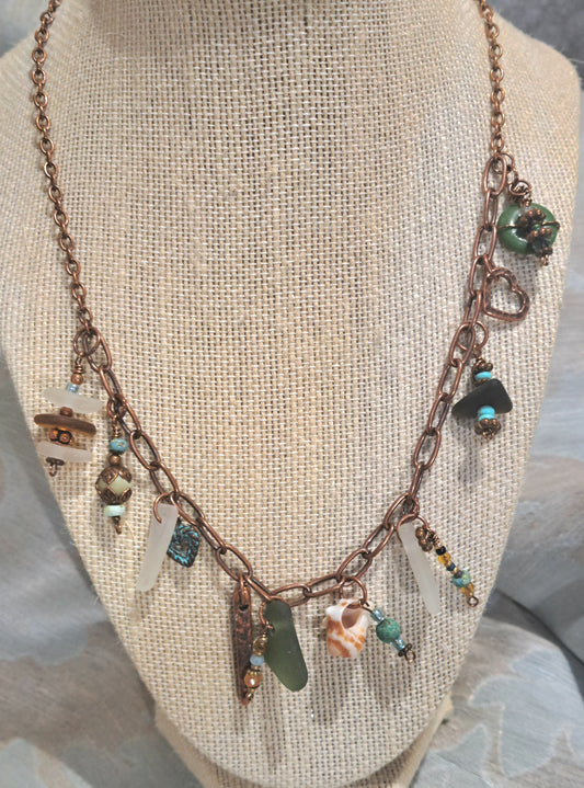 Whimsical Copper chain necklace adored with multiple sea glass pieces.