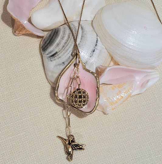 Conch Shell pendant necklace with Vintage gold bead and hummingbird,