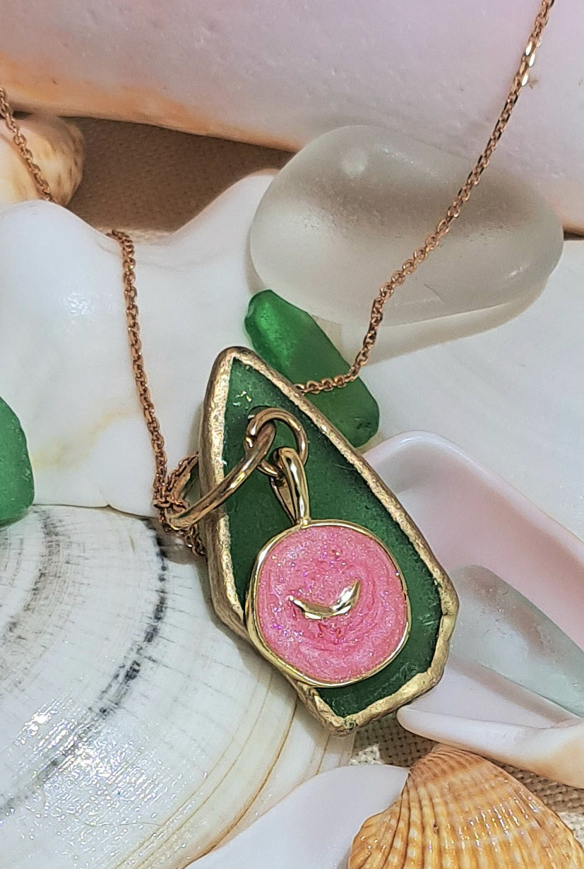 Green Sea Glass pendant necklace with pink whale tail charm.
