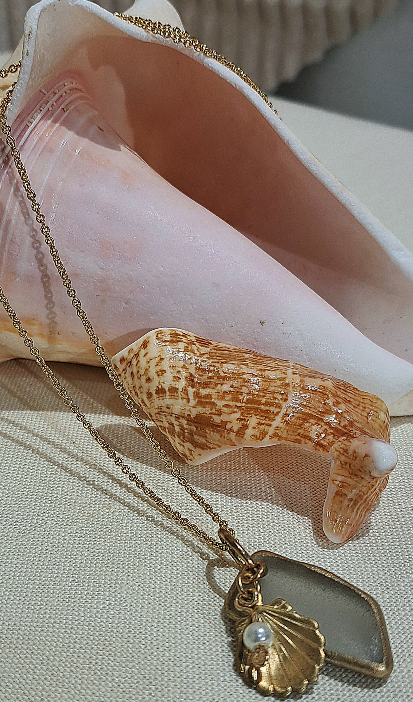 Sea glass Necklace with clam shell and pearl charm.