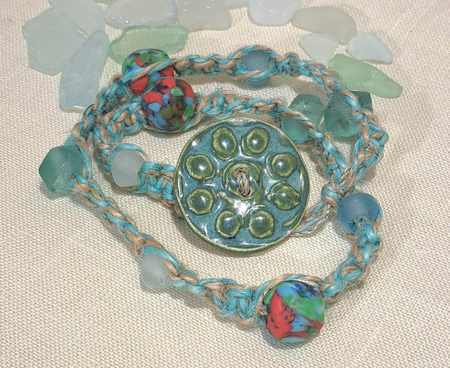Ladies double wrap green/blue bracelet with large ceramic button and java glass.