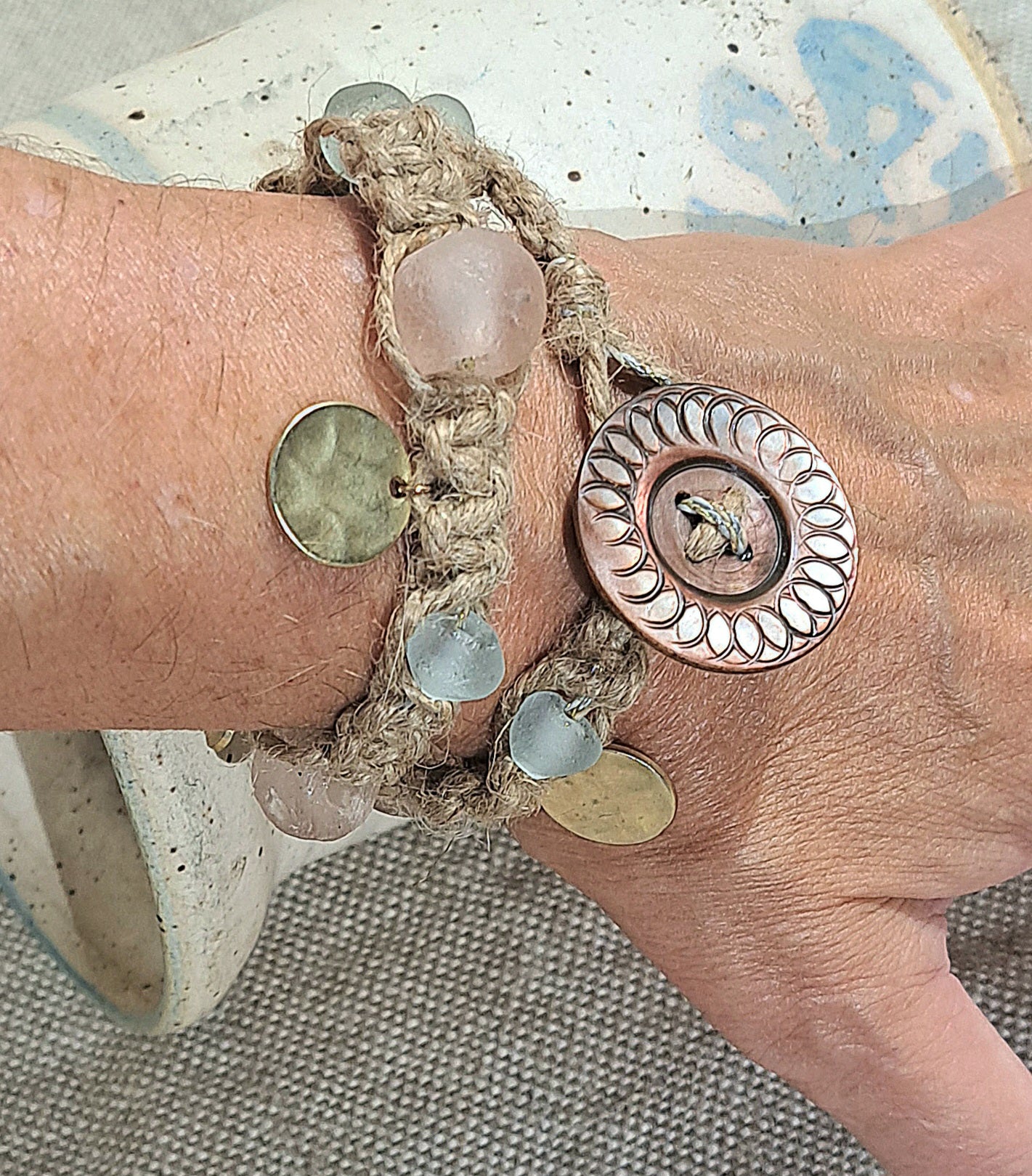 Jute wrap bracelet in pink and ice blue tones with unique Vintage button closure.