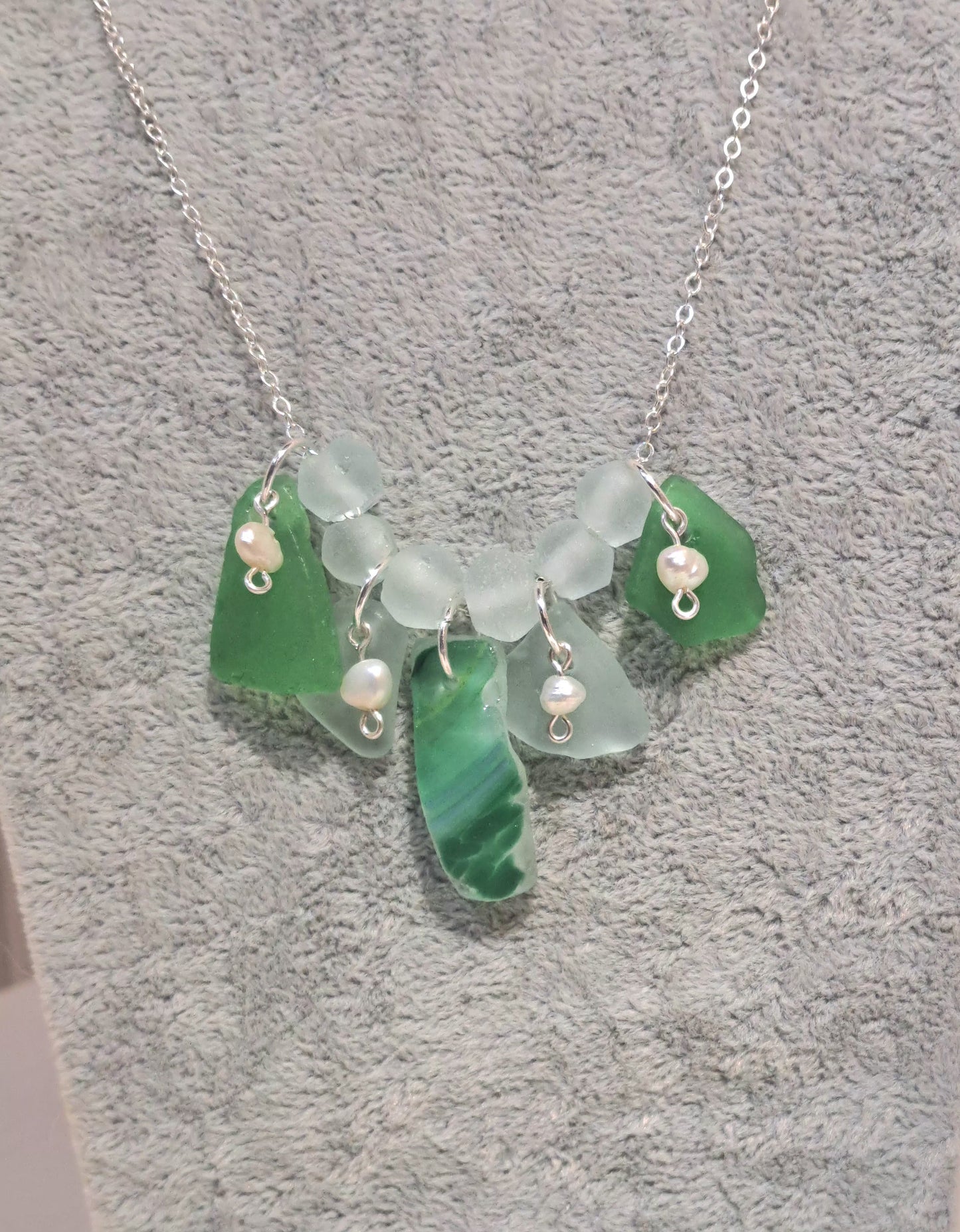 Green Sea glass necklace on silver chain with pearl accents.