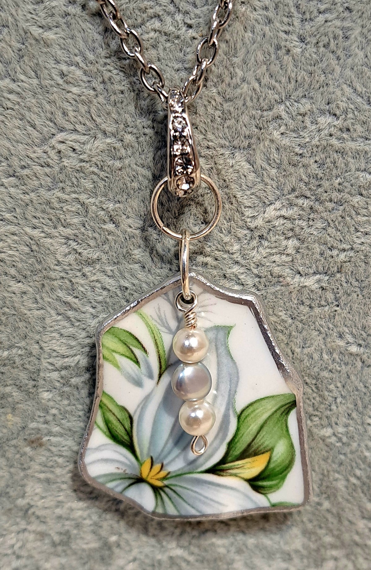 Broken china Trillium floral  pendant from sparkling bail.