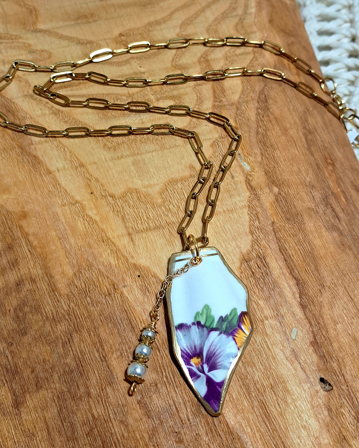 Broken china from England in a burgundy pansy design on waterproof gold paperclip chain
