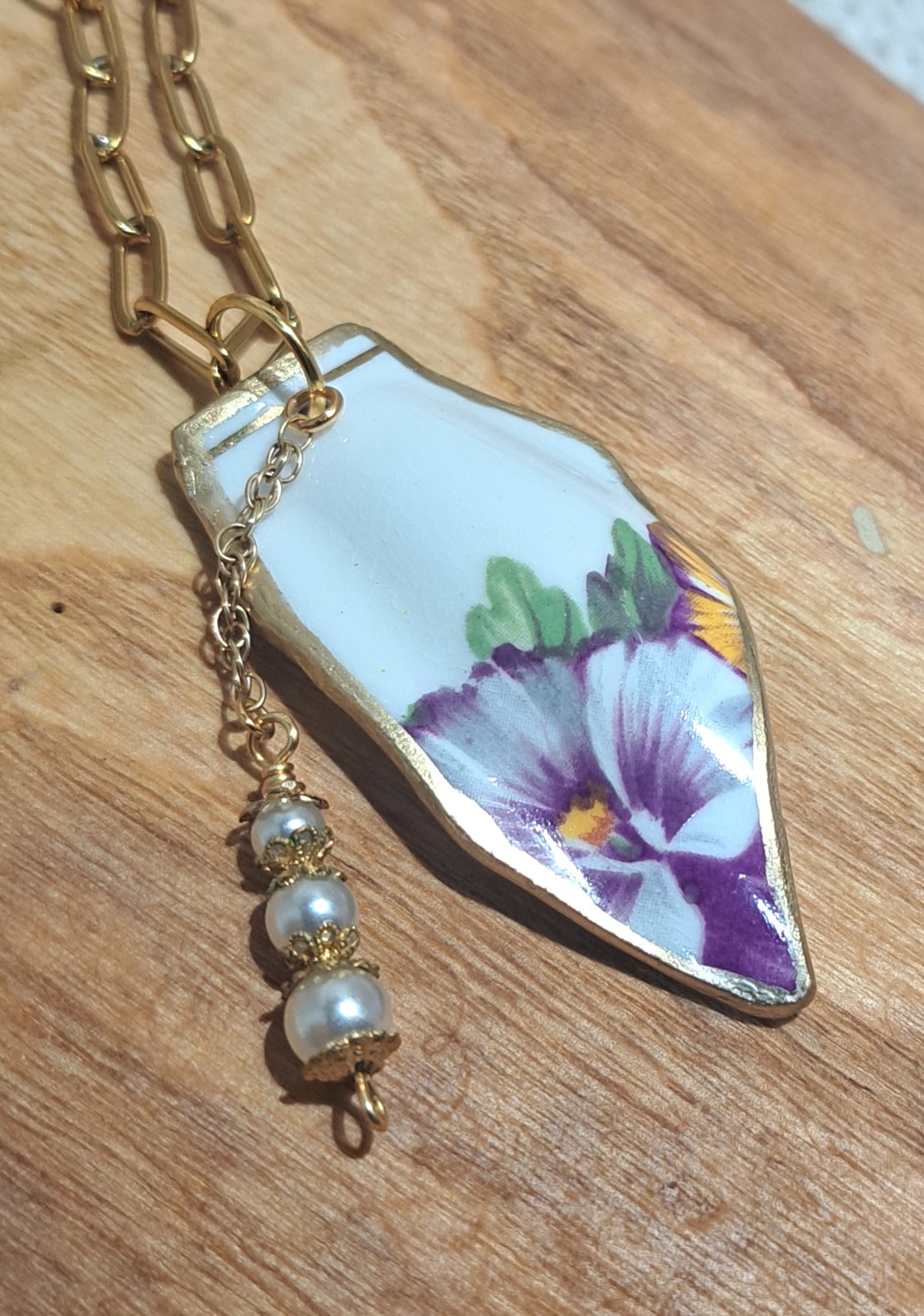 Broken china from England in a burgundy pansy design on waterproof gold paperclip chain