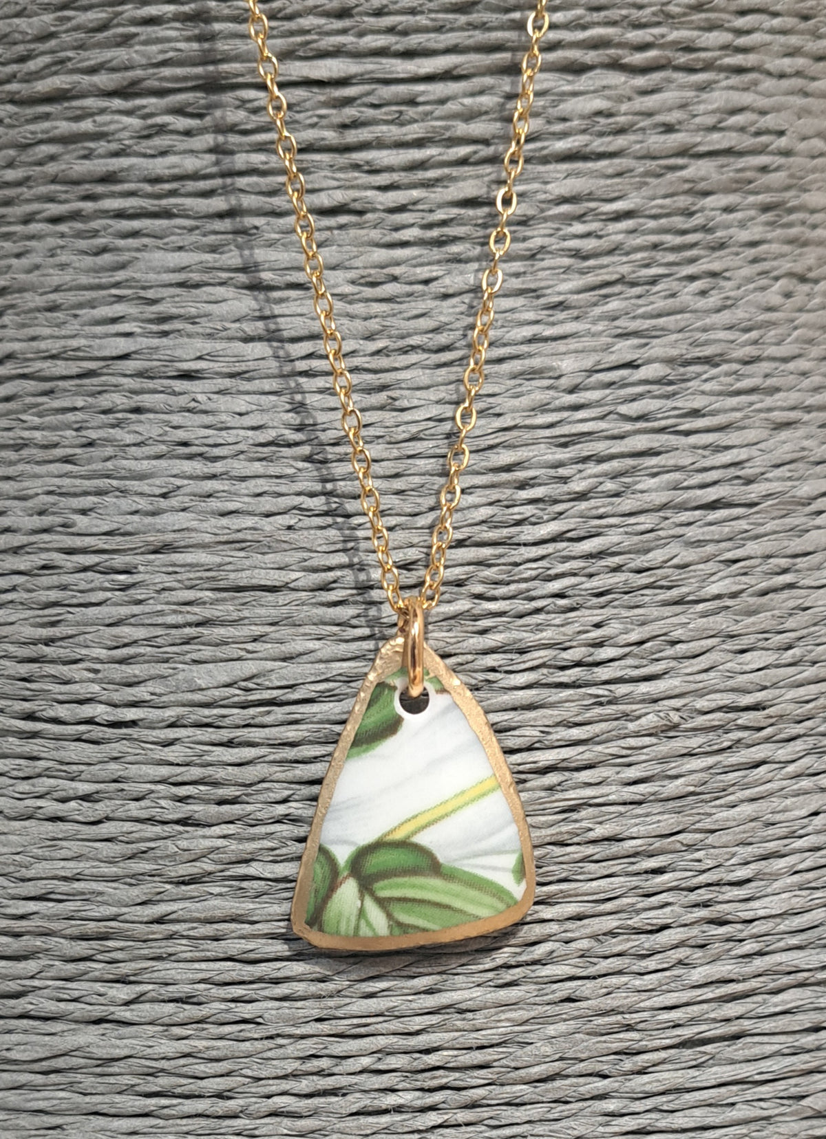 Broken China Trillium floral pattern on small loop gold chain
