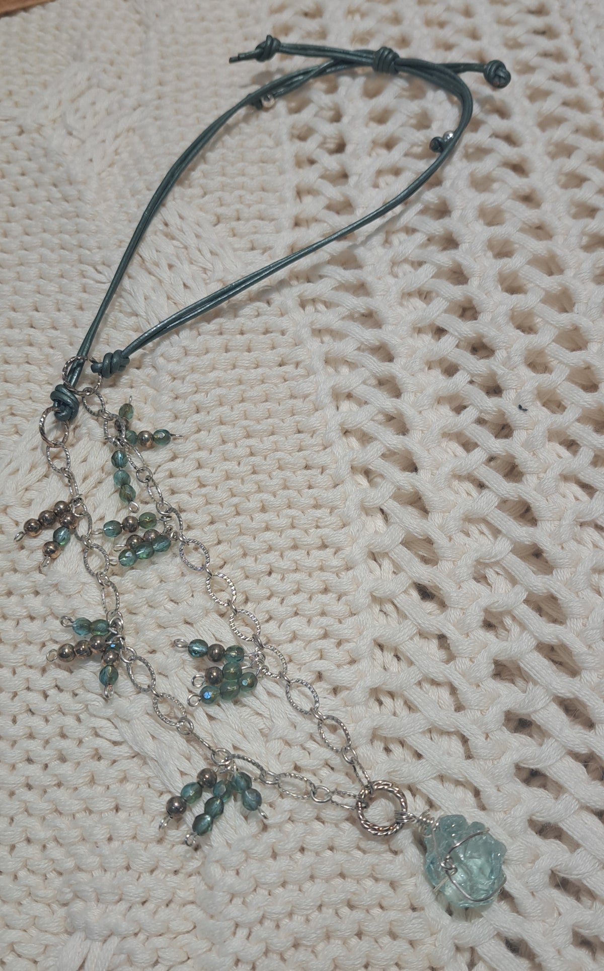 Green leather necklace with horse eye silver chain and green seed beads and green glass focal