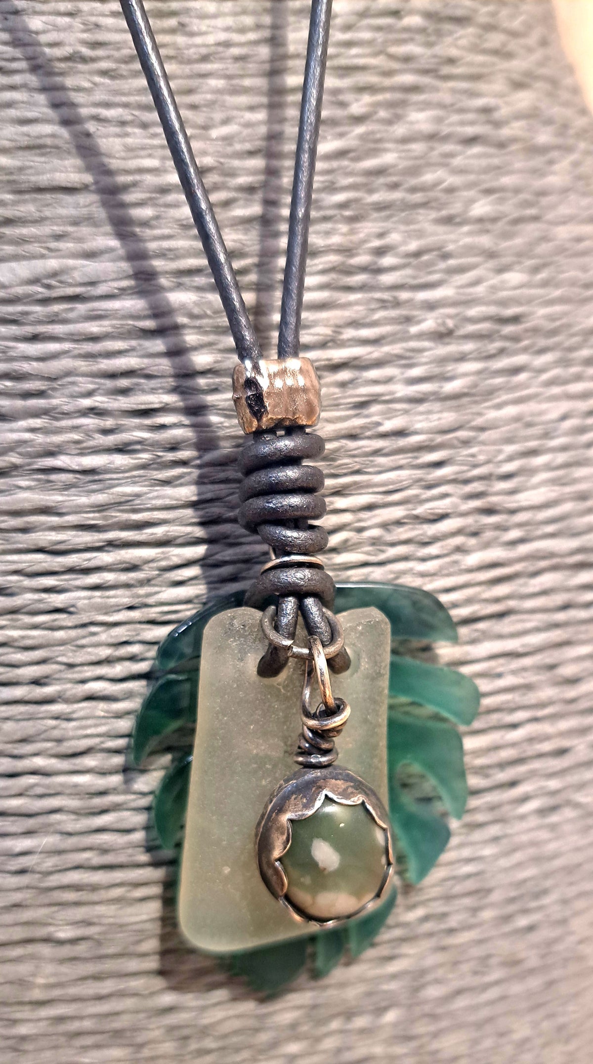 Leather slide knot adjustable necklace with leaf and pewter charm