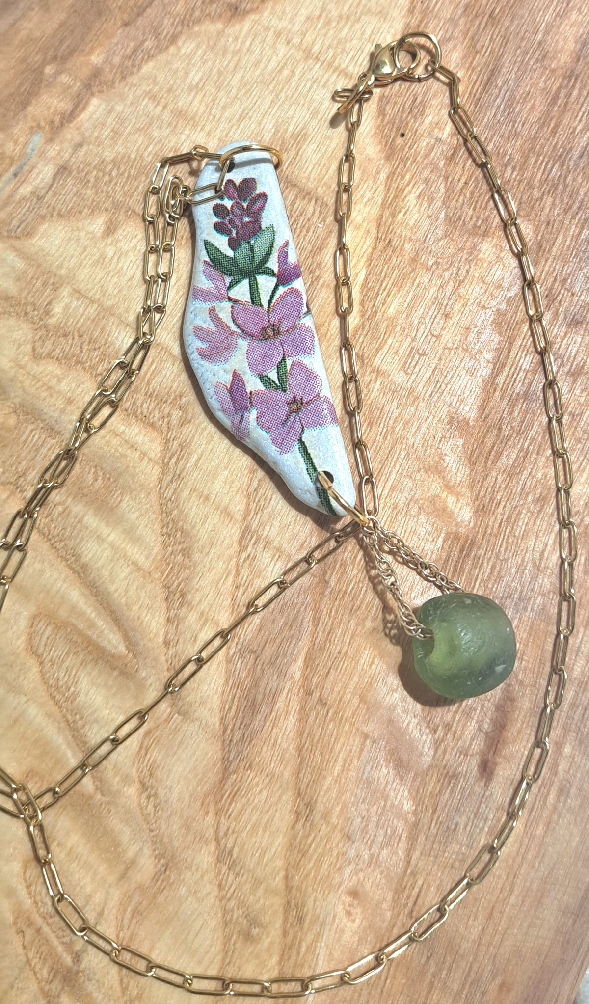 Appliqued stone floral reversible pendant necklace in purple and greens