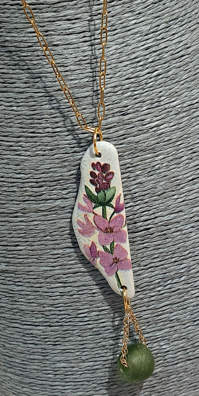 Appliqued stone floral reversible pendant necklace in purple and greens