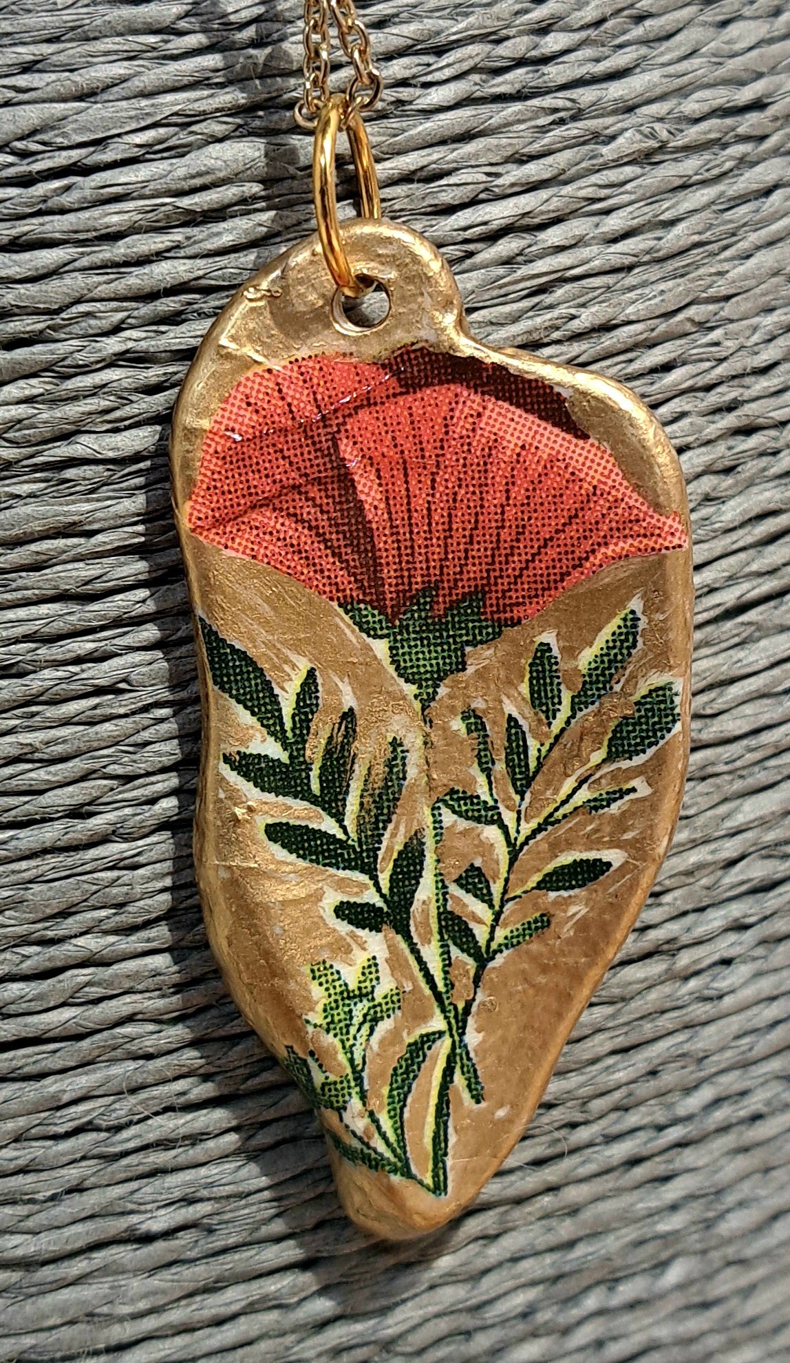 Sea shell pendant necklace with red floral design on gold chain