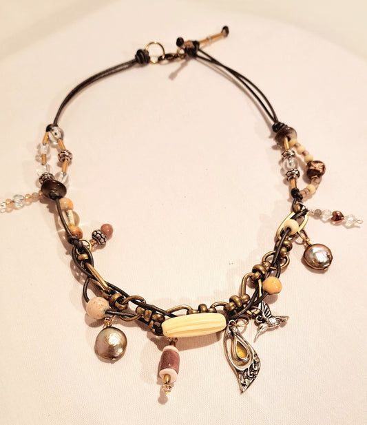 Bohemian inspired Grey leather and chunky brass link necklace.