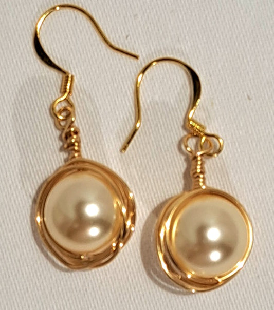 Swarovski wire wrapped pearl earrings.