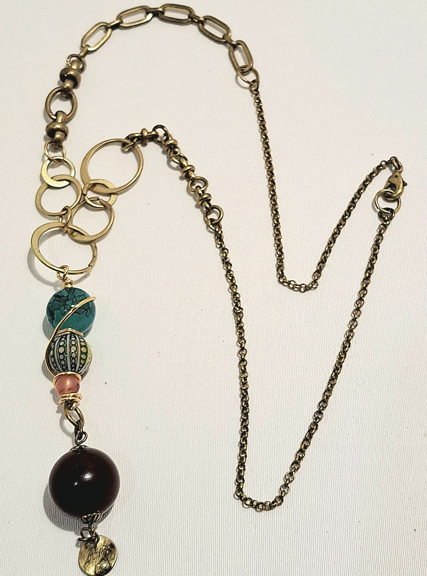 Brass varied link necklace with unusual bead combination.