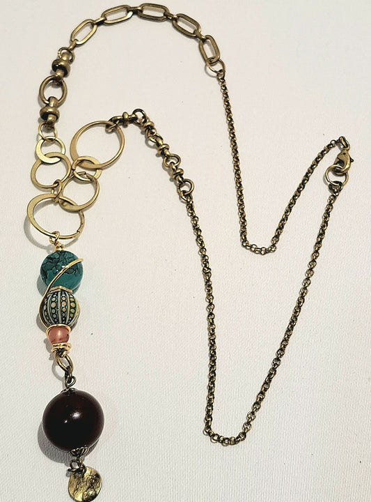 Brass varied link necklace with unusual bead combination.